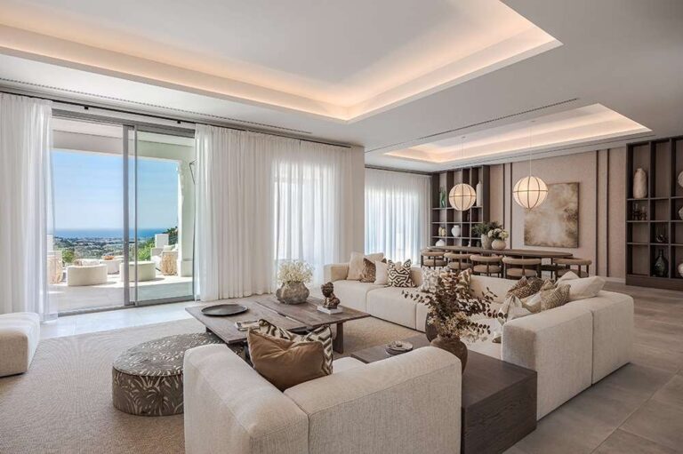 Pacific Palisades luxury house exterior rebuilt with warm stone, landscape and coastal light