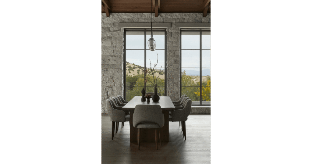 Dining area in D.L. House by MORANID, featuring wellness-centered light and refined illumination, and human-centered connection and flow.