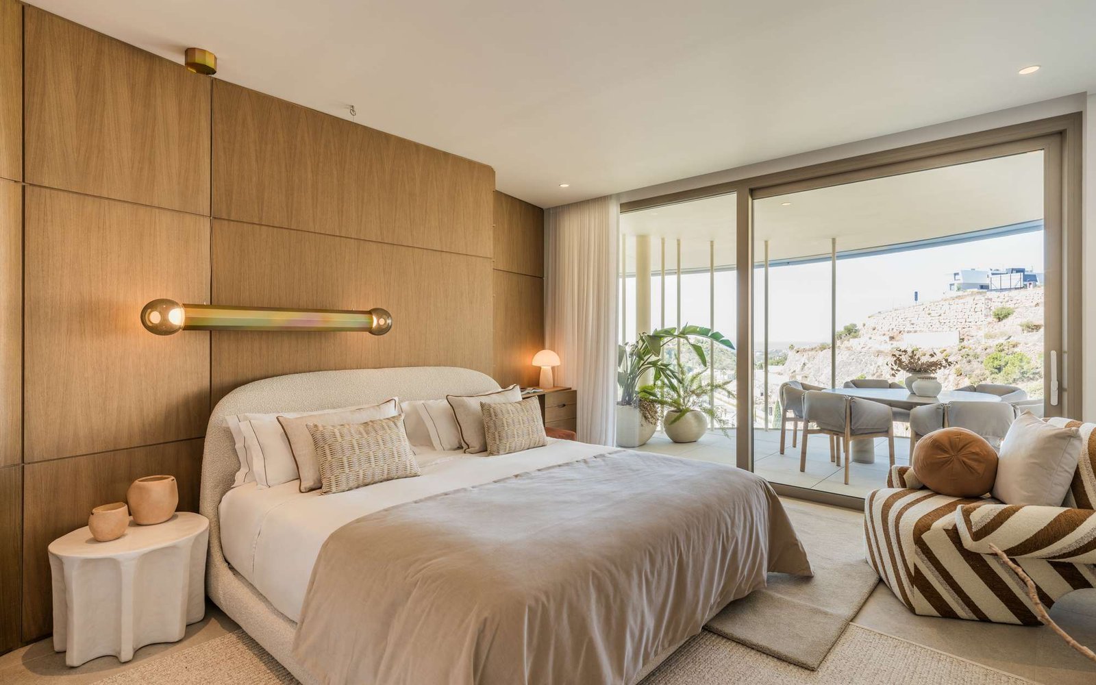 Bedroom in L.Z. Horizon Residence by MORANID, featuring natural materials and warm textures, and a calm work-focused atmosphere.