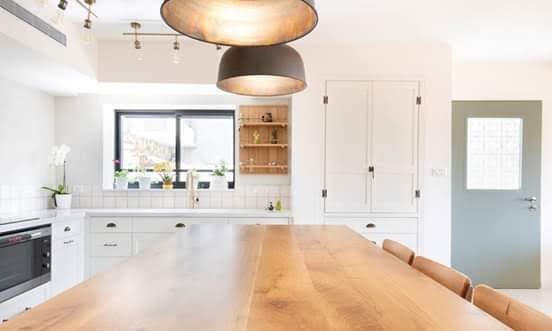 Kitchen in S.H. House by MORANID, featuring human-centered residential design and refined material balance.
