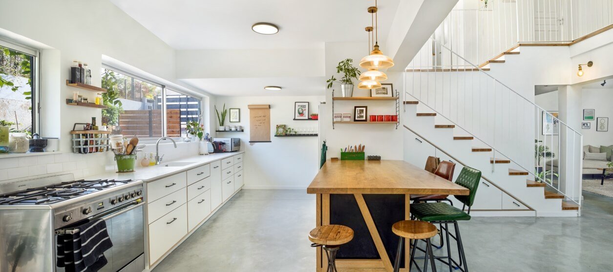 Kitchen in I.L. House by MORANID, featuring human-centered residential design and refined material balance.