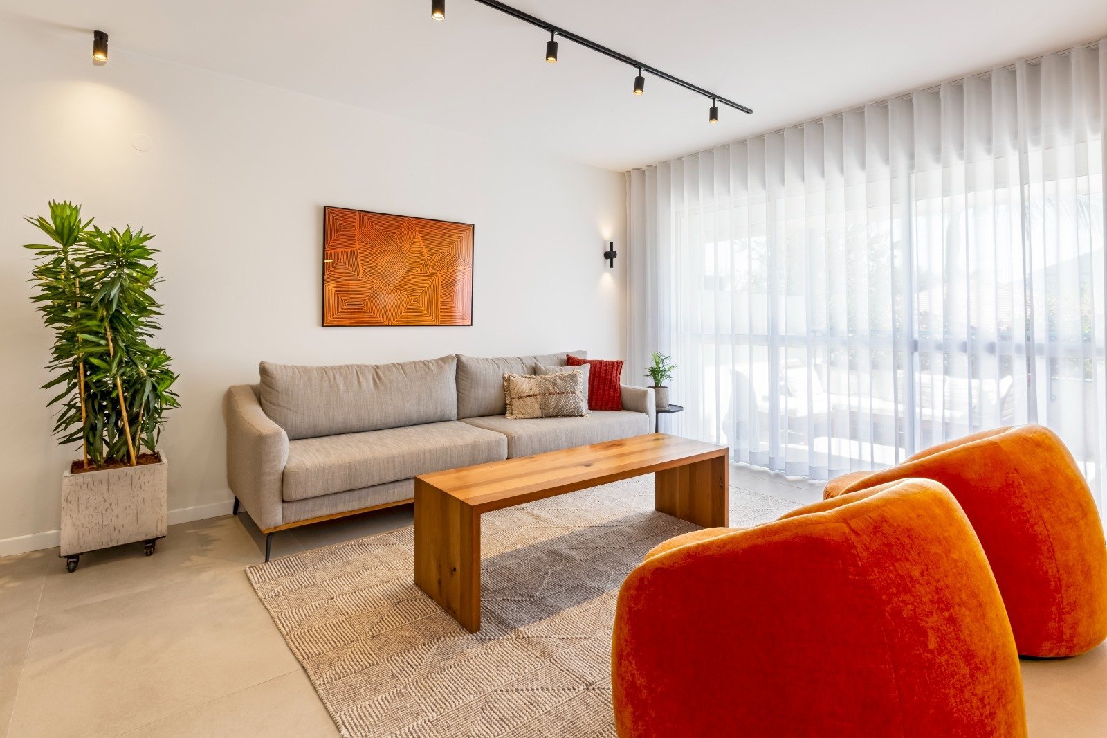 Living room in A.G. House by MORANID, featuring wellness-centered interior design, and human-centered connection and flow.